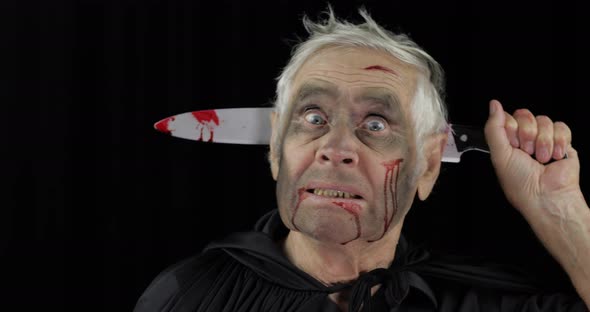 Elderly Man with Knife in Head. Halloween Makeup and Costume