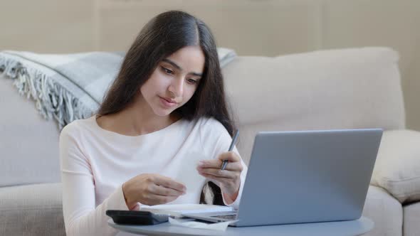 Young Housewife Arab Middle Eastern Woman Considers Utilities Uses Calculator Control Domestic