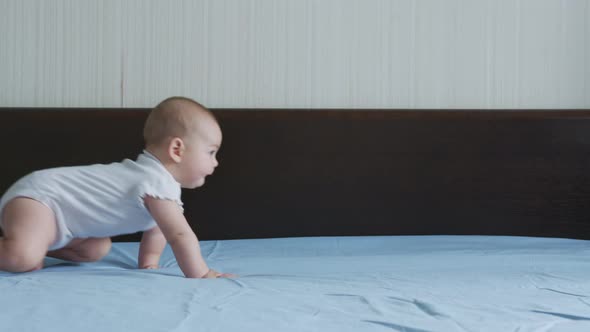 Happy Baby Girl Crawling on Bed Toddler Exploring Home Curious Infant Having Fun Enjoying Childhood