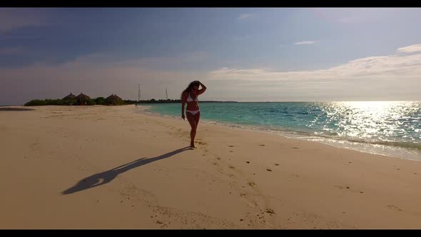 Woman suntans on luxury sea view beach trip by blue ocean with white sandy background of the Maldive