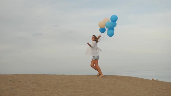 Young Woman with Helium Balloons