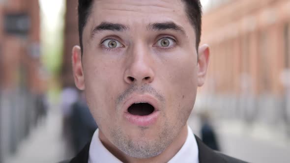 Outdoor Close Up of Shocked Businessman