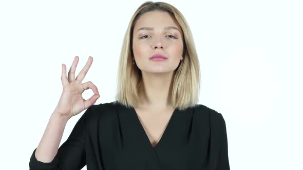 Young Woman Showing Ok Sign, White Background