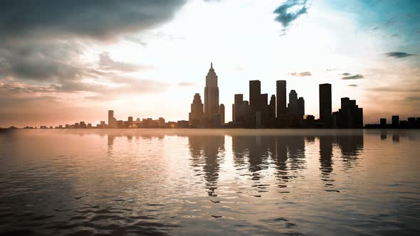 Skyline with Skyscrapers and Sea at Sunset