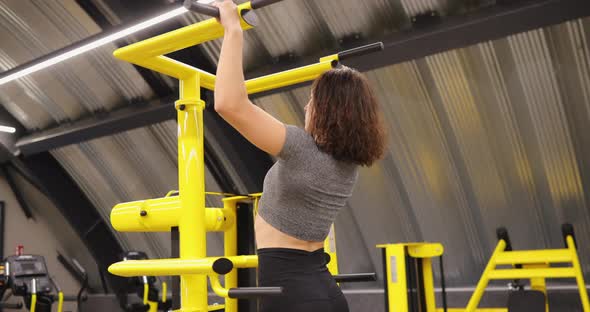 Woman Making Pullups Exercise