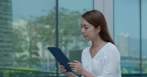 Woman look at digital tablet computer at outdoor