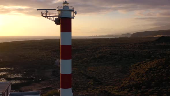 View From the Height of the Lighthouse Faro De Rasca Nature Reserve and Dark Clouds at Sunset on