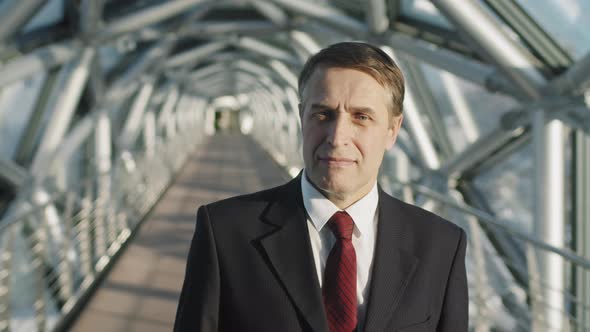 Portrait Of Successful Middle-Aged Business Man In Red Tie