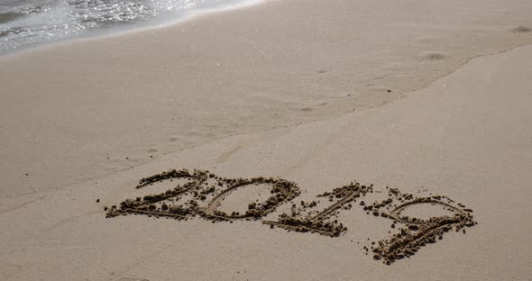 Number 2019 on sandy beach for new year concept