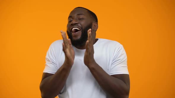 Happy African-American Man Rejoicing and Clapping Hands, Best Life Moments