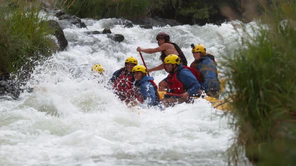 Super slow motion shot of group of people white water rafting, shot on Phantom Flex 4K