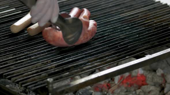 Uncooked Sausages Hand Tongs