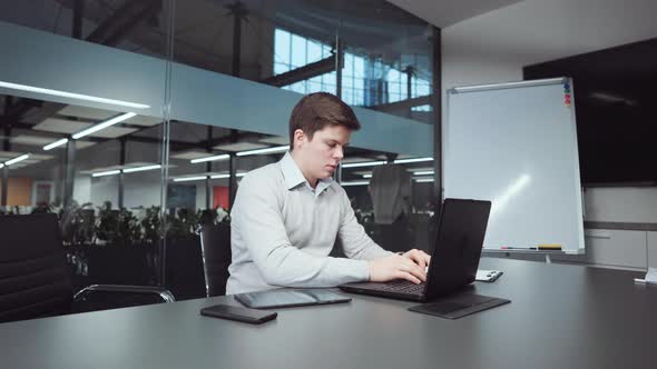 Businessman Preparing Report in Office