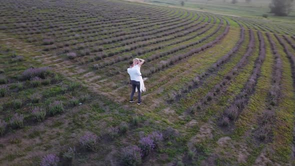 Young Couple Playing Around in the Lavender Fields