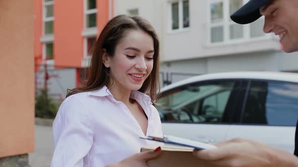 Delivery. Express Courier Delivering Package To Client Home