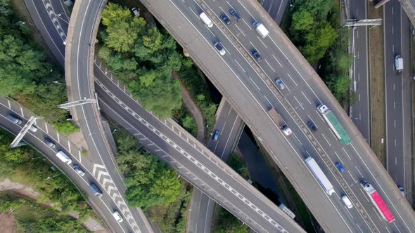 Vehicles Driving on a Spaghetti Interchange Bird's Eye Aerial View