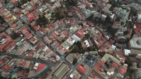 Aerial top down dolly in over picturesque Valparaiso hillside houses with red rooftops in Cerro Aleg