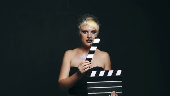 Woman With Movie Clapboard
