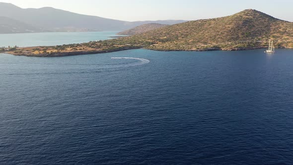 Aerial View of a Motor Boat Towing a Water Skier. Elounda, Crete, Greece