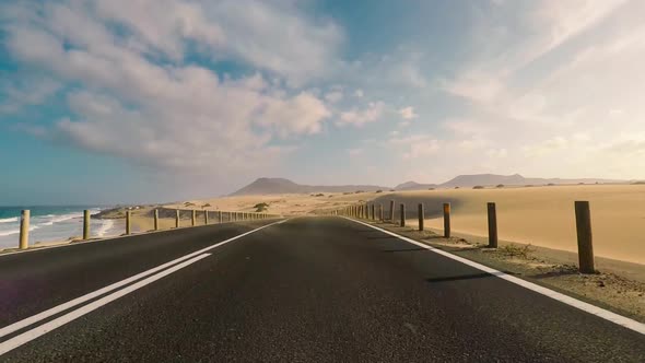 Travel and drive concept - long way off road viewed from car nose ground level