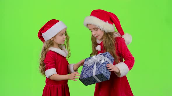 Baby Gives a New Year Gift To Her Friend. Green Screen