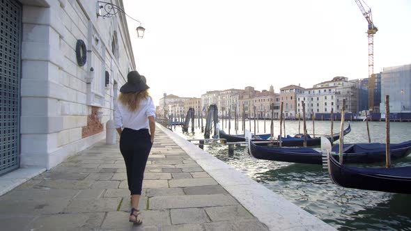 Girl Walking in Venice, Italy, Seeing Over Antique and Beautiful City