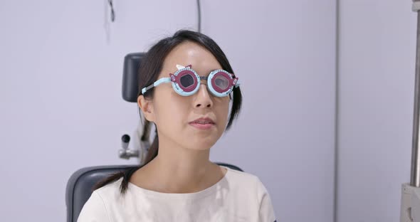 Woman Check on Eye in Clinic