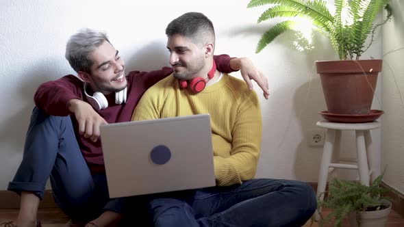 Gay Men Couple Having Fun Using Laptop Computer at Home  Lgbt Love Concept