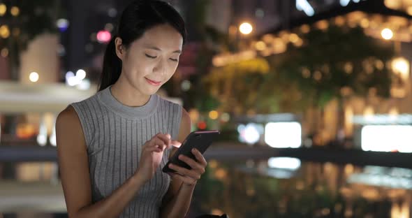 Young Woman Use of Cellphone in Hong Kong