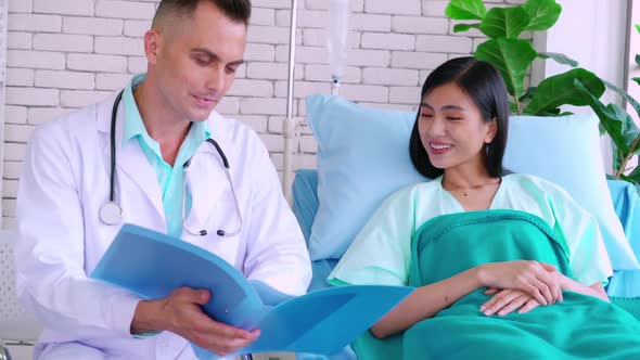 Doctor in Professional Uniform Examining Patient at Hospital