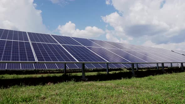 Surface of blue photovoltaic solar panels installed in the field