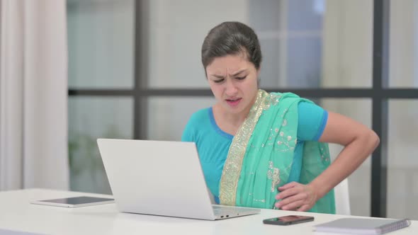 Indian Woman Having Back Pain While Using Laptop in Office