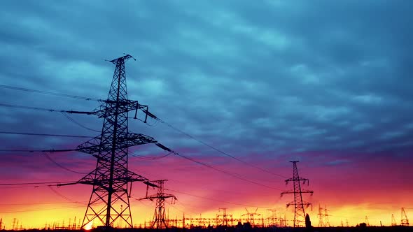 Hight voltage tower with blue sky and sunset. power transmission lines.
