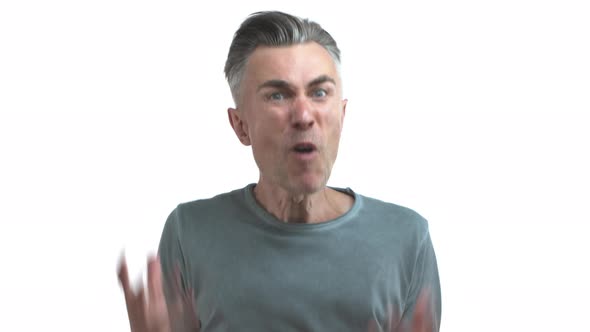 Middleaged Man with Grey Hair and Bristle Wearing Casual Clothes Losing Temper and Shouting