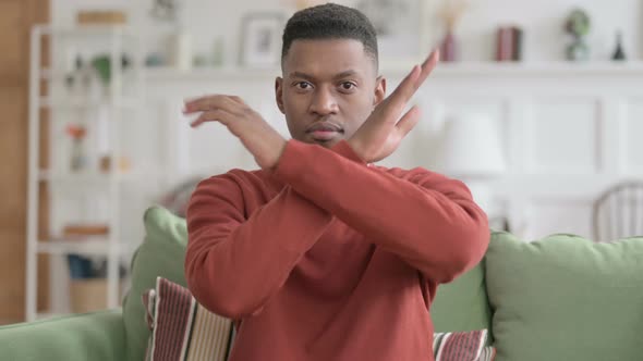 Portrait of African Man Showing No Sign by Arm Gesture