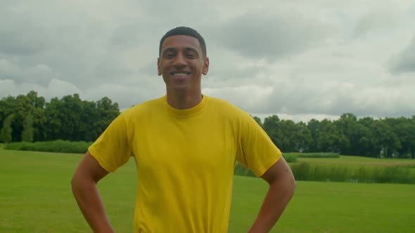 Lifestyle Portrait of Confident Attractive Black Male Smiling in Nature