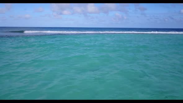 Aerial flying over travel of beautiful shore beach adventure by blue lagoon with white sandy backgro