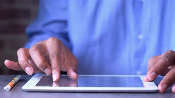 Young Businessman Working on Digital Tablet 