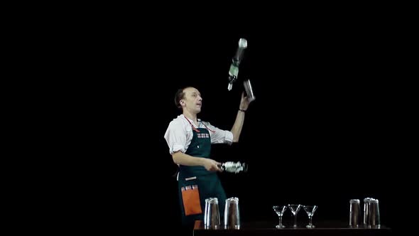 Isolated: Bartender Juggling the Objects on Black Background