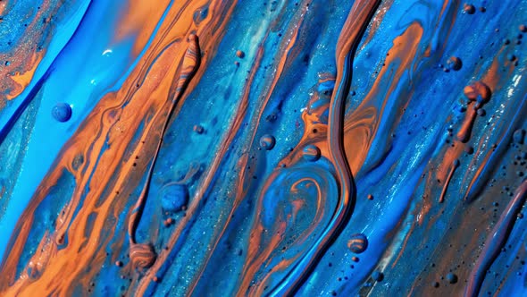 Abstract Close Up Texture of Oil with Orange, Yellow and Blue Paint. Wallpaper