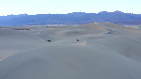 Flyover the endless sand dunes in the desert. Death Valley, California