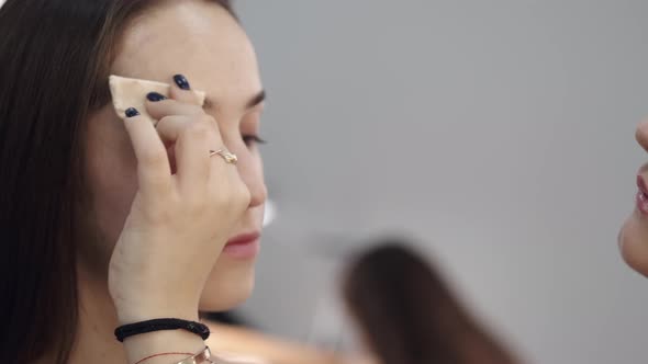 Cropped View of Brunette Woman's Face in Beauty Salon