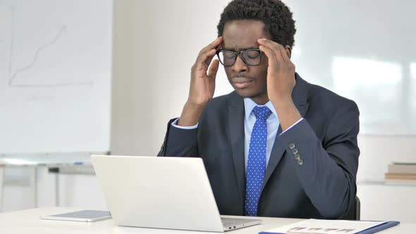 Headache, Tired African Businessman Working on Laptop