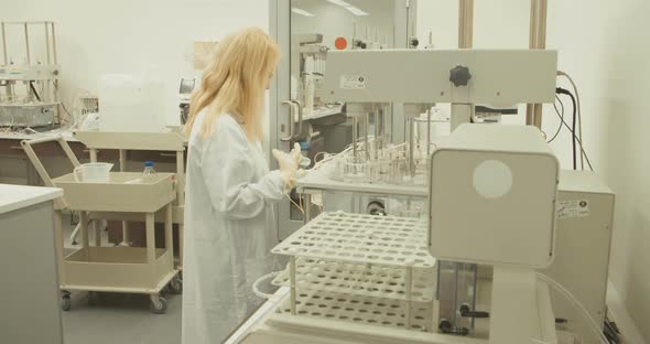 Scientist working in a pharmaceutical laboratory conducting experiments