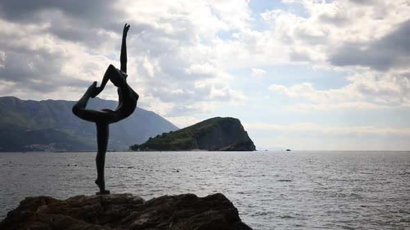 Statue of a Dancer on the Background of Old Town Budva Montenegro