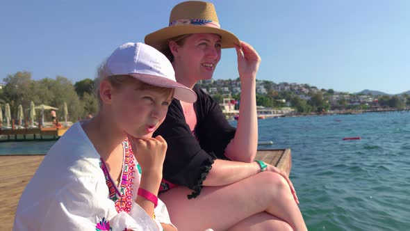 Girl With Mother On The Pier