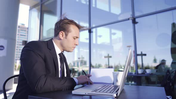 Businessman working outdoors.