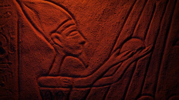Egyptian Carving Of Man With Offering In Firelight