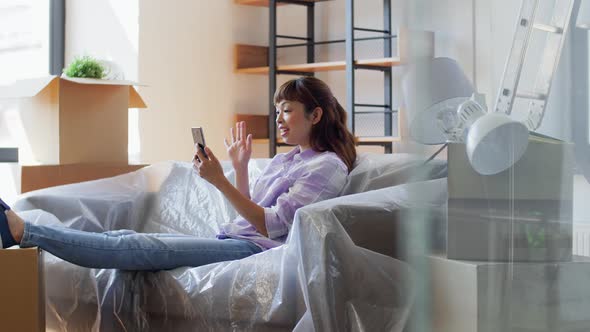 Woman with Phone Having Video Call at New Home