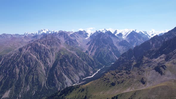 High Mountains Covered with Snow in Places